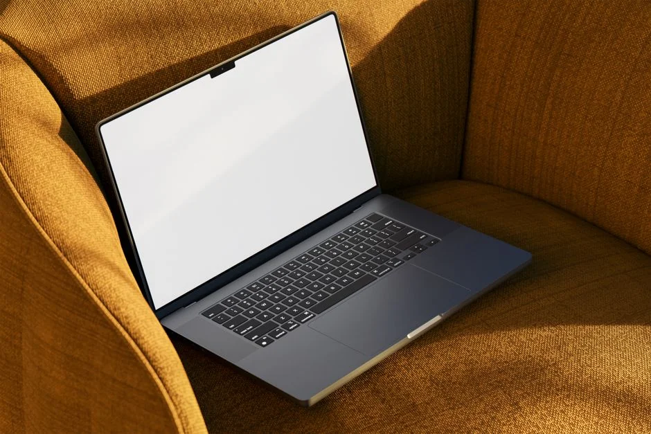 Two people browsing online clothing store on a laptop from above.